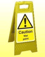 Caution wet paint freestanding sign Caution wet paint